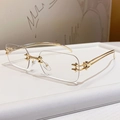 Chic gold-tone rimless square sunglasses with decorative star hinges and clear lenses - Bright Gold Blue Light Blocking