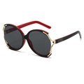 Fashionable oversized round sunglasses in black and red with gold metal trim and cutouts - Black Red Frame Black Grey Lens