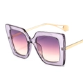Square purple sunglasses with gradient lenses and gold metal temples on a white background - Transparent Gray Frame Gray Pink Lens