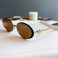 Gafas de sol ovales vintage con montura negra, patillas doradas y lentes marrones - Montura Dorada Negro Semimate Lentes Té