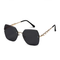 Modieuze randloze oversized polygoon zonnebril met goudkleurige hartjes en stras - Gouden Frame Zwart Grijs