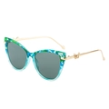 Occhiali da sole cat-eye con montatura floreale blu-verde e stanghette a farfalla oro - Montatura Floreale Verde Lenti Grigie