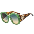 Occhiali da sole poligonali verde traslucido con stanghette a motivo leopardato - Montatura Verde Asta Leopardata Lente Verde Giallo
