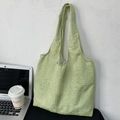 Detailed view of light green tote bag with 3D leaf texture on a textured wall background - Textured Leaf Embroidery (Green)