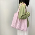 Detail shot of the pink checkered canvas tote bag showing lightweight textured fabric - Pink