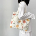 Off-white canvas tote bag featuring vibrant orange fruit prints and flower patterns - Lemon Style Double-Sided Print