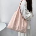 Detail of light pink tote bag featuring embossed butterfly textures and large capacity - Pink