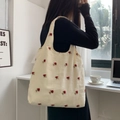 Detailed embroidery of red roses on a beige canvas tote bag with a soft fabric texture - New Rose Embroidery with Canvas Lining