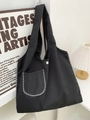 Minimalistische schwarze Canvas-Tragetasche mit Karomuster und Fronttasche für Alltag - Schwarz