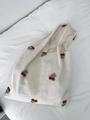 Detailed view of cherry blossom embroidery on off-white canvas tote bag for women - Cherries (Cherry Embroidery + Canvas Lining)