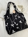 Detail of black tote bag with white leaf embroidery, casual canvas aesthetic for women - White Foliage Embroidery (Black Fabric)