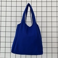 Close-up of deep blue canvas tote bag featuring reinforced stitching and inner lining detail - Sapphire Blue