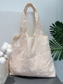 Detailed macro view of white leaf embroidery on a beige lace canvas tote bag - White Leaf Embroidery (Pink Fabric)
