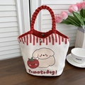Close-up of canvas bucket bag featuring red rope handles and dog tomato illustration - Cute Dog