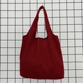 Detail of burgundy canvas tote bag showing durable cotton fabric texture and wide handle - Burgundy