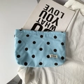 Light blue corduroy pouch with dark brown polka dots and a zipper closure for makeup storage - Sky Blue Polka Dot Pouch