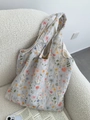 Detail of colorful floral embroidery on light blue quilted canvas tote bag fabric - Full Floral Embroidery (Light Blue)