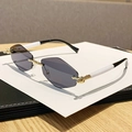 Fashionable rimless rhombus sunglasses with gold metal hinges and black white temples - Solid Grey