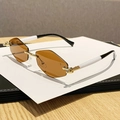 Frameless octagonal sunglasses with brown lenses and black-white spliced temples - Transparent Tea
