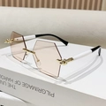 Rahmenlose Hexagonal-Sonnenbrille mit Teeverlauf-Gläsern und schwarz-weißem Bügeldesign - Transparentes Tee