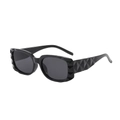 Fashionable black irregular geometric sunglasses with deep gray lenses shown at a 45-degree angle - Black Frame Black Grey Lens
