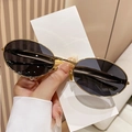 Lunettes de soleil ovales rétro avec monture dorée et verres gris foncé pour femmes - Monture Dorée Verres Gris