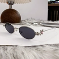 Occhiali da sole ovali in metallo argento con lenti scure e dettagli in strass lucidi - Nichel Lucido Grigio