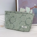 Sage green rose embossed fabric cosmetic bag with floral texture and logo label - 3D Floral Green Makeup Bag