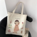 Detail of white canvas tote bag featuring a cute girl illustration and soft long handles - Cream (You are a pretty girl!)