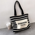 Minimalist black and white striped canvas tote bag with Fashion Trends printed on the front - Black and White Striped - TRENDS Print (TRENDS Double-sided Pattern)
