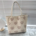 Off-white canvas tote bag featuring red hearts and Tu es aimé French text print - Beige