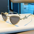 Fashion heart-shaped sunglasses with gold rhinestone frame and star temple accents - Solid Grey