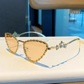 Golden heart-shaped cat-eye sunglasses with star rhinestones and amber lenses - Transparent Orange