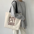 Minimalistische Canvas-Tragetasche mit Retro-Tomaten-Logo und schwarzen Trägern - Beige (CITY Beige Canvas Tasche)