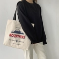 Borsa tote minimalista in tela beige con stampa montagna e spalline nere per uso quotidiano - Borsa Beige MOUNTAINS