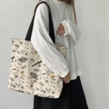 Off-white canvas tote bag with black comic graffiti print and shoulder straps - Beige