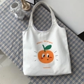 Dettaglio della borsa in tela bianca con stampa di arance e testo Happy Oranges - Stampa Arancia Cartoon / Bianco Sporco