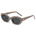 Retro oval sunglasses with beige frame and dark lenses, 45-degree angle product view - Grey Tea Frame Black Grey Lens