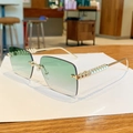 Fashionable rimless sunglasses featuring green gradient lenses and textured gold metal temples - Gradient Green