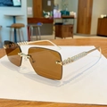Frameless rimless sunglasses with brown gradient lenses and gold rivet textured legs - Transparent Tea