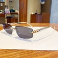 Retro rimless sunglasses with dark grey lenses and golden textured metal temples - Solid Grey