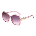 Stylish oversized pink translucent sunglasses with gradient lenses and gold rose detail - Pink Frame Gray Pink Lens