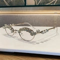 Oval rhinestone sunglasses with a metal frame and crystal-encrusted rim design - Silver Frame Clear Lens