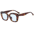 Vintage tortoiseshell cat eye sunglasses with light blue lenses on a white background - Tortoiseshell Frame Blue Lens