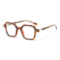 Classic tortoise shell hexagonal frame glasses with golden star accents on white backdrop - Leopard Frame