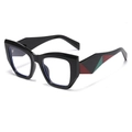 Lunettes de soleil cat-eye à monture noire et branches géométriques rouge et vert - Monture Noire Verre Clair