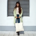 Macro shot of a plain off-white cotton canvas tote bag showing handle detail and texture - White Shoulder Bag with Zipper