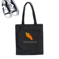 Detail shot of black canvas tote bag with orange carrot print and sturdy shoulder straps - Black Carrot