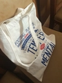 White canvas tote bag with blue football player typography and sturdy handles - White (Letter Print)