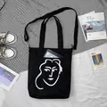 Détail du cabas en toile noire avec dessin au trait artistique et bandoulière réglable - Glamour Frais Noir (Double Usage)